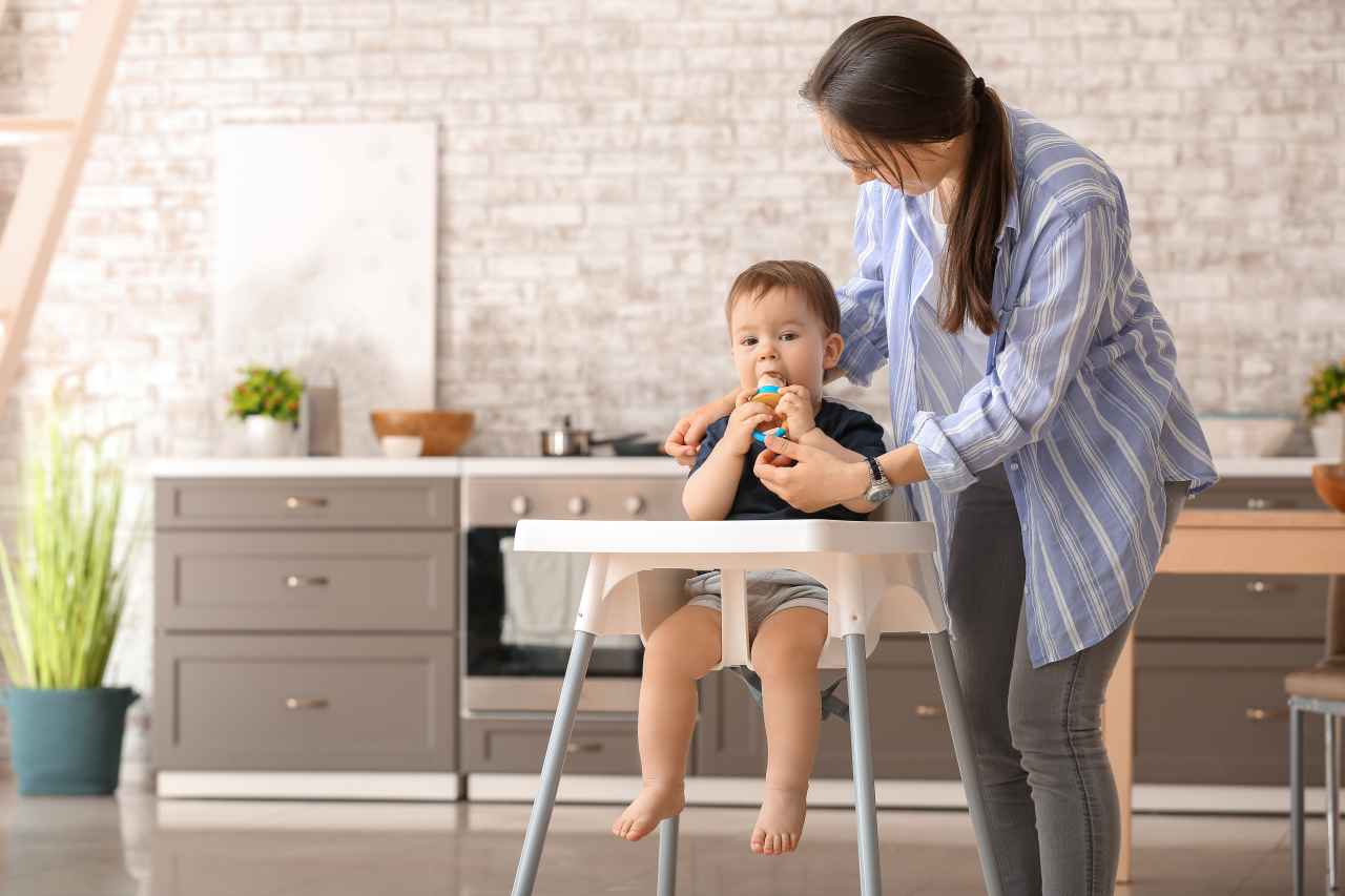 Toddler sitting on high chair